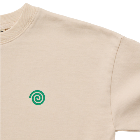 Beige long sleeve t shirt with a green spiral logo on a white background