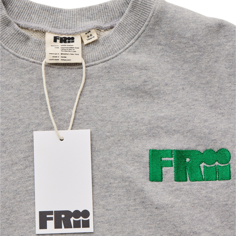 Gray sweatshirt with green frii logo embroidered and white frii tag on a white background