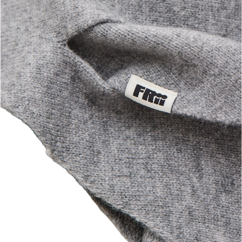 Gray scarf or baby big with a brand frii label on a white background