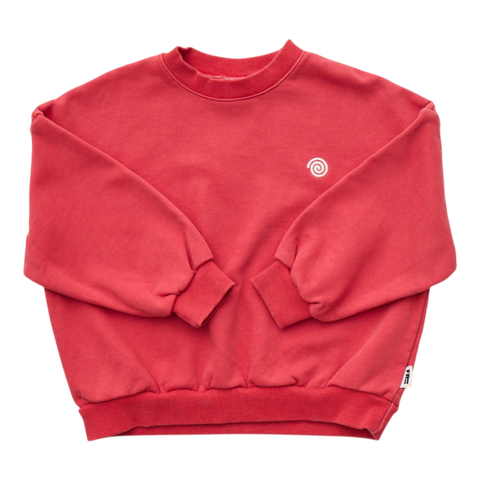 Red sweatshirt with a small white swirl logo on a white background